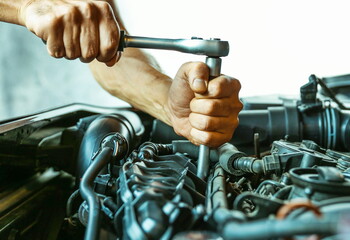 car service concept photo. motor repairing close up. mechanic hands are repairing car engine