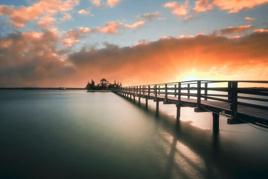 Porto Lagos Church On A Lake With A Wodden Bridge