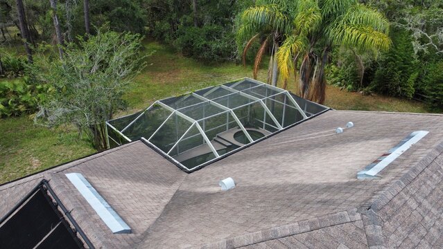 Aerial Drone Photo of House Pool Screen Enclosure and Roof near Tampa Florida