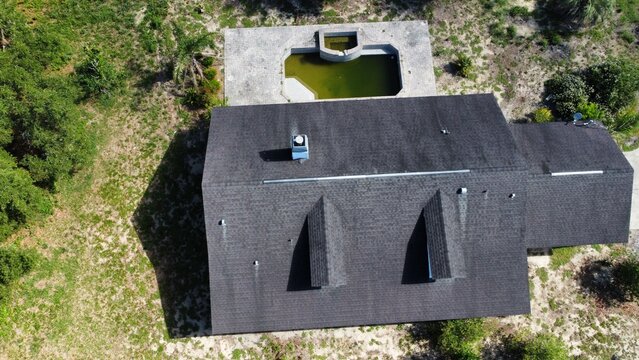 aerial drone photo of roof of house with pool