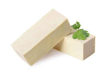 Piece of tofu with parsley leaves on white. 
