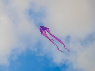 A kite in the sky. Upwards. Wind. Kite Festival. Colorful toys.  Beauty in the sky Holiday at the resort