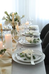 Festive table setting with beautiful floral decor in restaurant