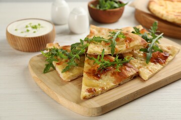 Delicious khachapuri with cheese served on white wooden table