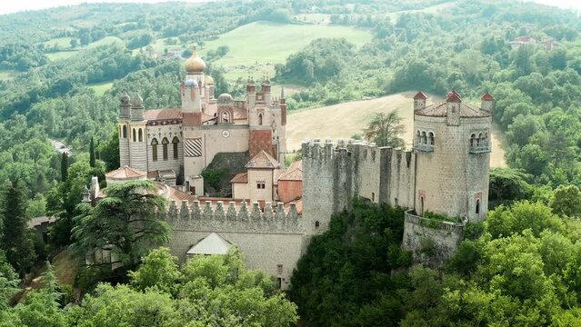 Aerial drone panoramic view of the Rocchetta Mattei castle in Italy on sunny summer day, view from above. High quality 4k footage