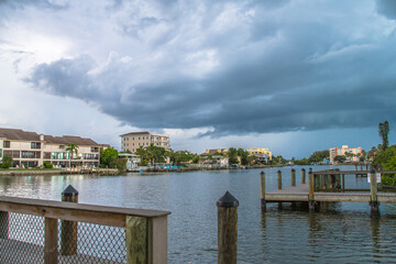 View from Turtle Beach over Blind Pass overlooking the water, pier, and docks. See condominiums and residences in the distance of this popular luxury Siesta Key nieghborhood
