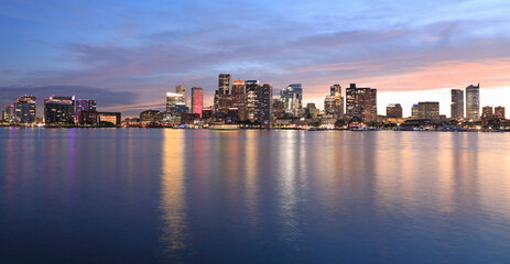 Fototapeta na wymiar Boston skyline and harbor at dusk with Atlantic Ocean on the foreground, USA 