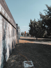 Park with brick mill and large trees