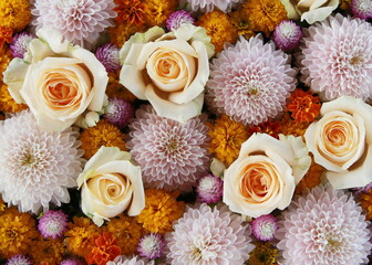 Composition of white and orange flowers. Flower arrangement with chrysanthemum and roses.