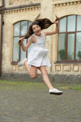 surprised funny teen girl. jumping girl having fun. teenager girl jump outdoor