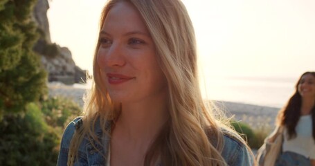 Fun, playful and happy friends on beach bonding, having fun and waving goodbye spending day, sunset or sunrise near sea or ocean. Smiling women walking together on summer holiday or tropical vacation