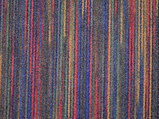 カラフルな色の糸が縦に編まれた布地のテクスチャー