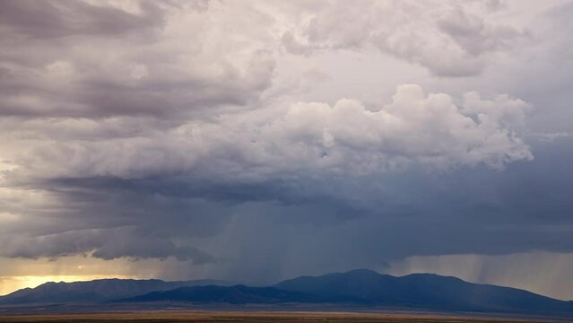 Timelapse of rain storm moving over the desert mountains in Utah during summer monsoon season.