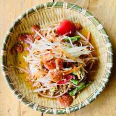 Som Tum - Thai Spicy green papaya salad with salty eggs - Asian food style