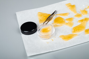 smoking cannabis extract, piece golden resin shatter...