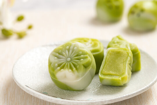 Traditional Chinese mid autumn festival dessert snowy skin mooncakes. The flavor is matcha green tea with pantan lotus paste