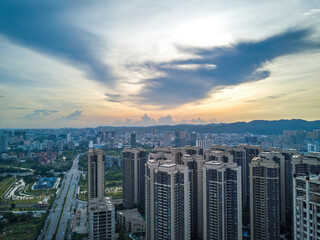Fototapeta premium City building complex buildings and highway landscape in evening sunset