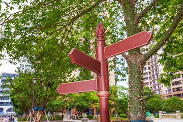 Close-up of directional street signs in residential building complex