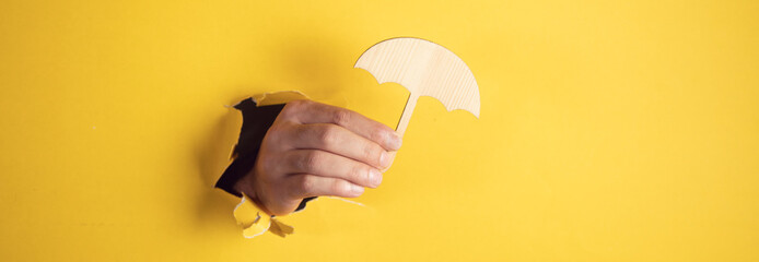 man hand wooden umbrella