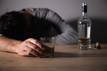 Man holding glass of alcohol