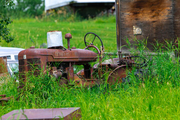 Antique tractor in long grass