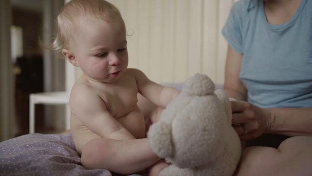Happy Baby Playing With Teddy Bear With Mother At Home - Jablonec nad Nisou, Czechia