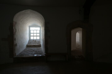 Bright sunlight finding its way into the interior of a coastal fortress in kent.