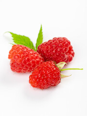 Isolated berries. Bunch of raspberry fruits with leaves isolated on white background with clipping path