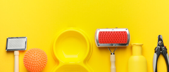 Different pet accessories on yellow background, top view
