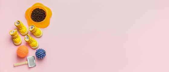 Different pet accessories and food on light pink background with space for text, top view