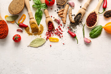 Composition with fresh aromatic spices on light background