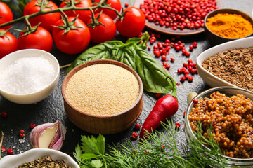 Fresh aromatic spices on dark background
