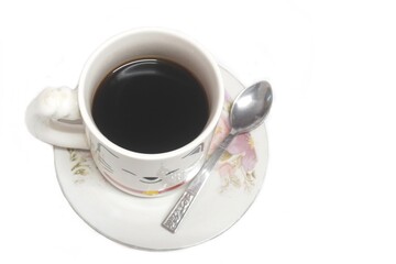 black coffee in a white cup with stainless steel spoon