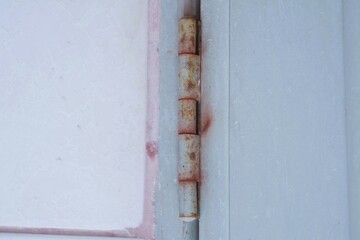 Old and rusty door hinges