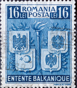 ROMANIA - CIRCA 1940: a postage stamp from Romania , showing the coats of arms of The Balkan Entente. Circa 1940