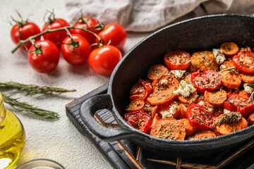 Baking dish of tasty baked vegetables on table, closeup