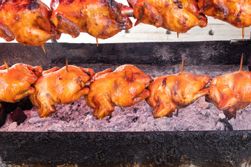Roasted Whole Chicken on Charcoal Stove. Thai Food