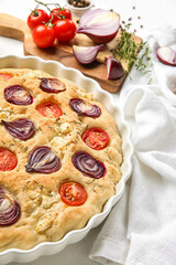 Baking dish of tasty Italian focaccia on table, closeup