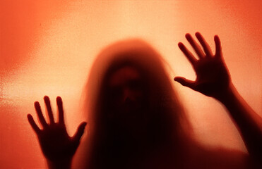 Shadowy figure behind glass - horror background