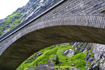 Famous Devil's Bridge at Schöllenen Gorge, Canton Uri, on a sunny summer day. Photo taken July...