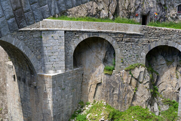 Fototapeta na wymiar Famous Devil's Bridge at Schöllenen Gorge, Canton Uri, on a sunny summer day. Photo taken July 3rd, 2022, Andermatt, Switzerland.