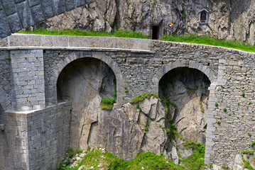 Famous Devil's Bridge at Schöllenen Gorge, Canton Uri, on a sunny summer day. Photo taken July...