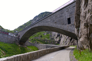 Famous Devil's Bridge at Schöllenen Gorge, Canton Uri, on a sunny summer day. Photo taken July...