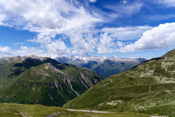 Serpentine mountain pass road of Nufenen Pass in the Swiss Alps on a sunny summer day. Photo taken July 3rd, 2022, Nufenen Pass, Switzerland.