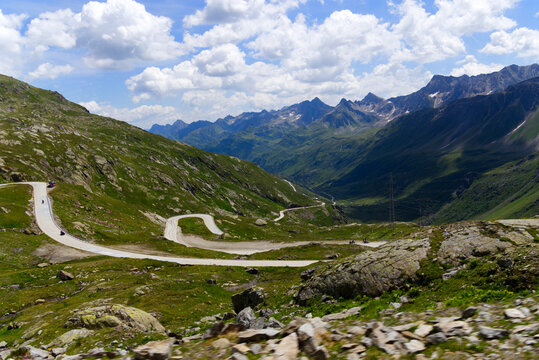 Scenic view of Bedretto Valley, Canton Ticino, with mountain pass road of Nufenen Pass on a sunny summer day. Photo taken July 3rd, 2022, Val Bedretto, Switzerland.