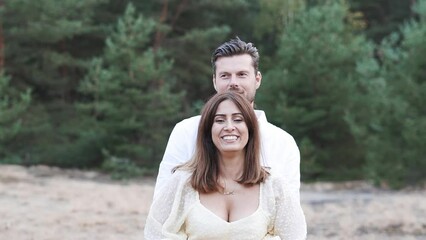 Husband making his wife smile on their pre wedding shoot.