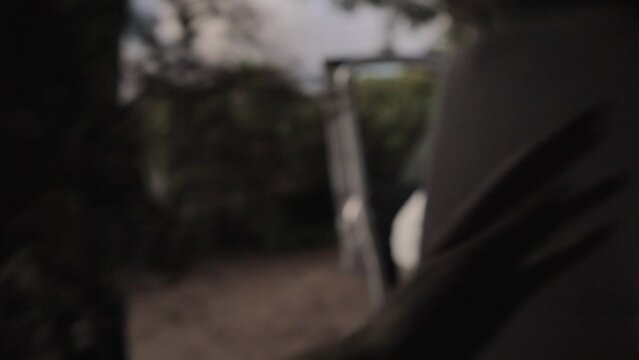 A static shot of a Caucasian female having smiling face getting on in a van for travelling