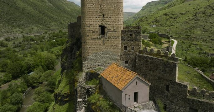 Close Up Pullback In Historical Monument Of Khertvisi Fortress Ruins On Top Of High Rugged Mountain In Southern Georgia. Aerial Drone Shot