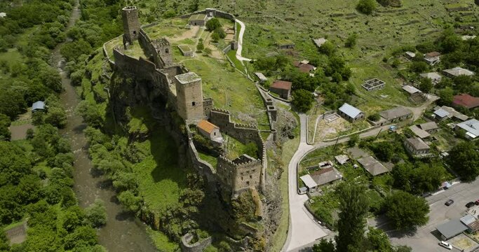 Aerial View Of The Oldest Structure Of Khertvisi Citadel With The Caucasus Mountains In Meskheti, Southern Georgia.