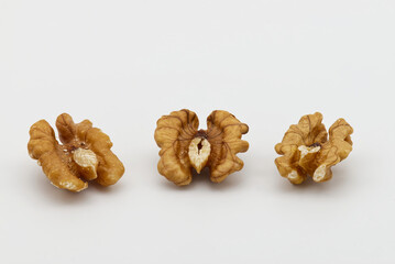 Three walnuts isolated on white background. Food texture concept
